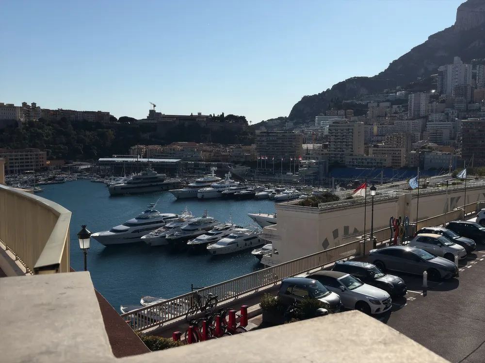 Superyachts in a Dubai marina — yacht charter price guide
